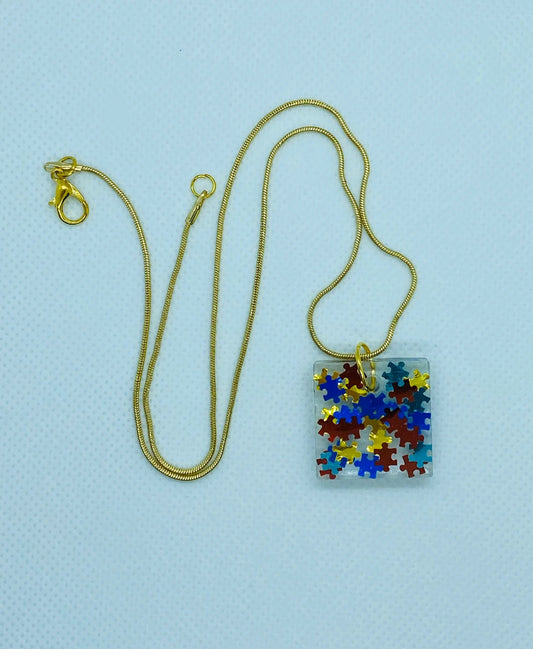 Puzzle Piece Resin Pendant-Autism Awareness jewelry, Square Pendant with 18" long gold-colored chain, Primary Colors