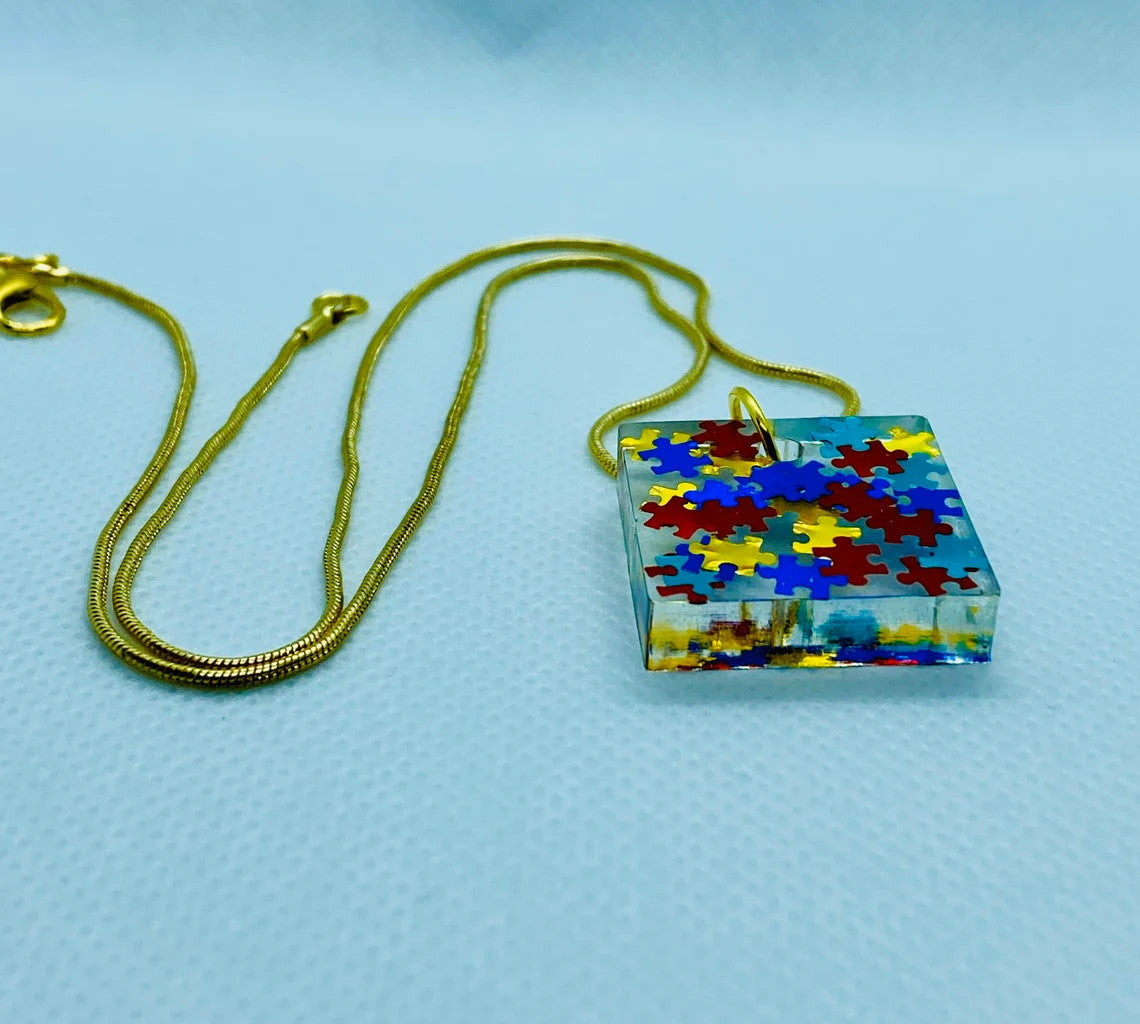 Puzzle Piece Resin Pendant-Autism Awareness jewelry, Square Pendant with 18" long gold-colored chain, Primary Colors