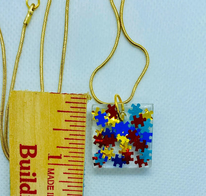 Puzzle Piece Resin Pendant-Autism Awareness jewelry, Square Pendant with 18" long gold-colored chain, Primary Colors